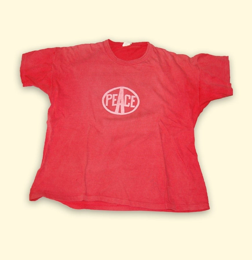 red shirt with word peace in center.jpg